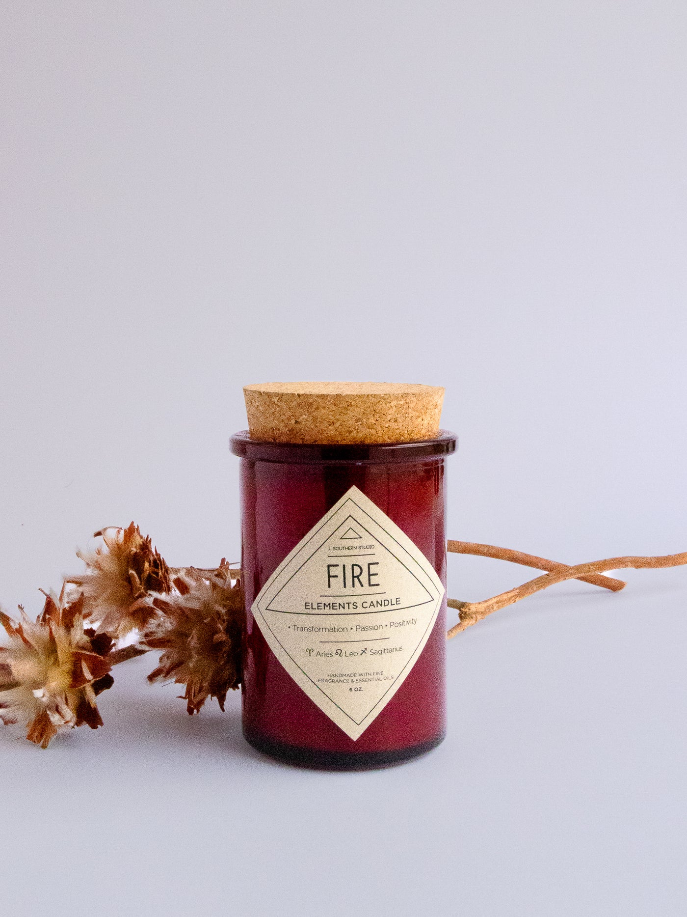 Fire Element Candle with tobacco, allspice, black pepper, cedarwood.
