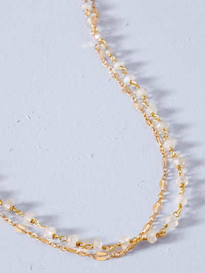 Moonstone Gold Ashlyn Anklet. A layered anklet featuring chain-linked moonstone and 14k yellow gold fill chain with an added extension chain to ensure a perfect fit. Adjustable length 8.5-10".