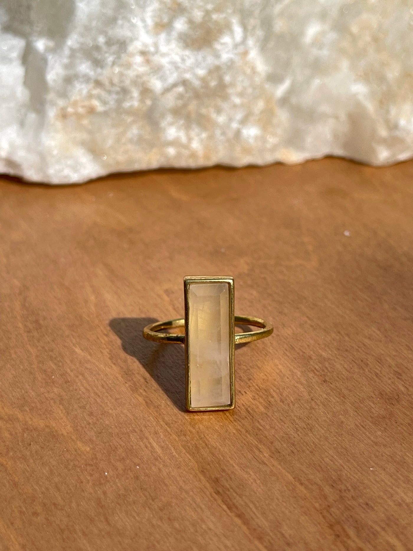 ROSE QUARTZ GEM BAR RING is bezel-set in a recycled brass band with 24K gold overlay. Size 7.