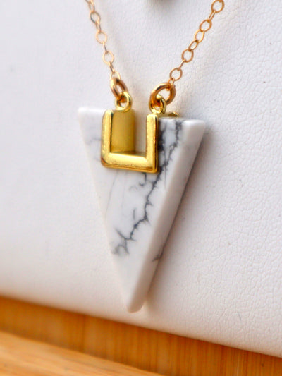 HOWLITE TRIANGLE GEOMETRIC NECKLACE. Howlite triangle geometric stone hangs delicately from a 14K gold filled 18" chain.
