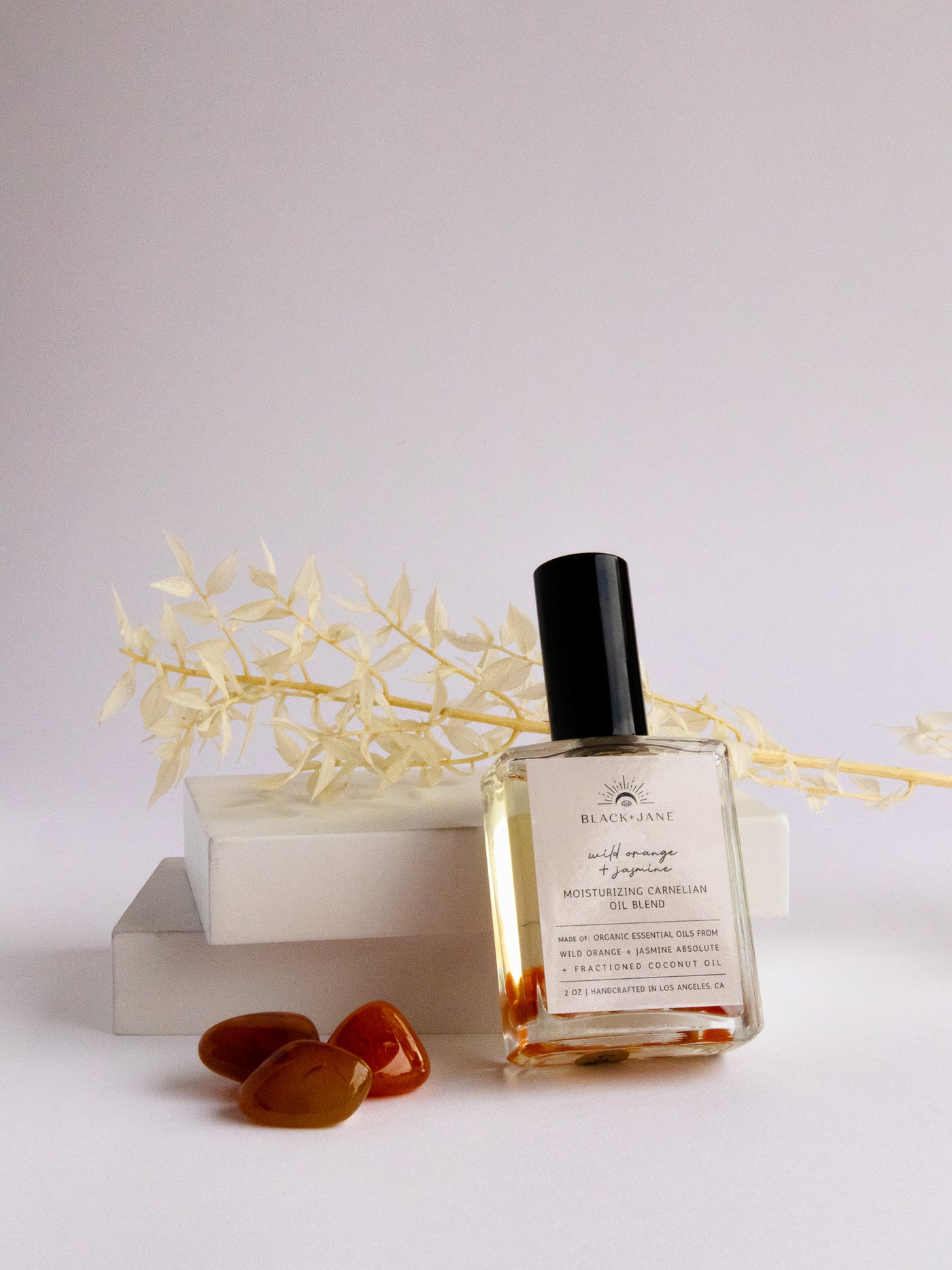 WILD ORANGE + JASMINE CRYSTAL INFUSED CARNELIAN MOISTURIZING OIL BLEND.