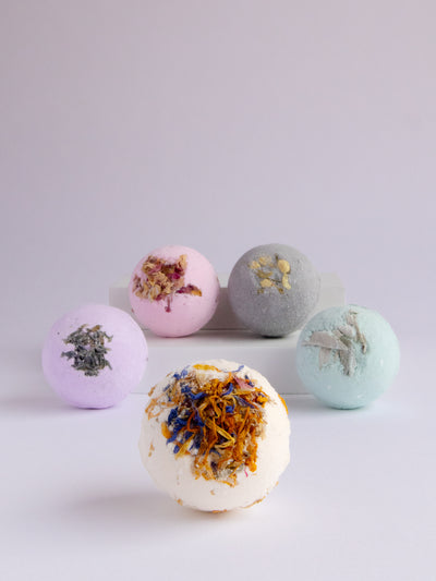 Wildflowers Bath Bomb is made with coconut oil, mixed dried flowers (roses, jasmine, corn flower, marigold) and tangerine essential oil.Handmade in Ojai, CA.
