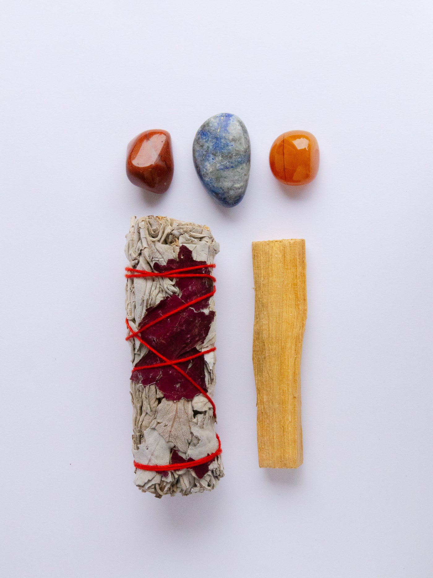 Creativity and Inspiration Crystal Kit with Lapis Lazuli, Red Jasper, Carnelian, White Sage, and Palo Santo.