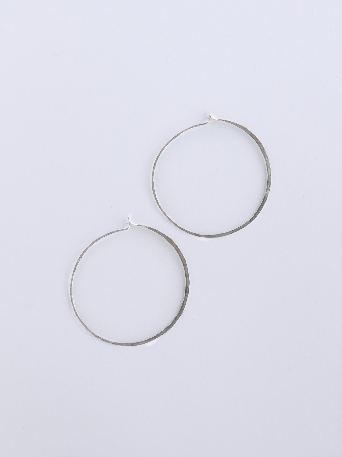 Silver Large Crescent Moon Hoops made from 20 gauge wire are hand made with high quality hammered sterling silver metal and measure 1.5" across.