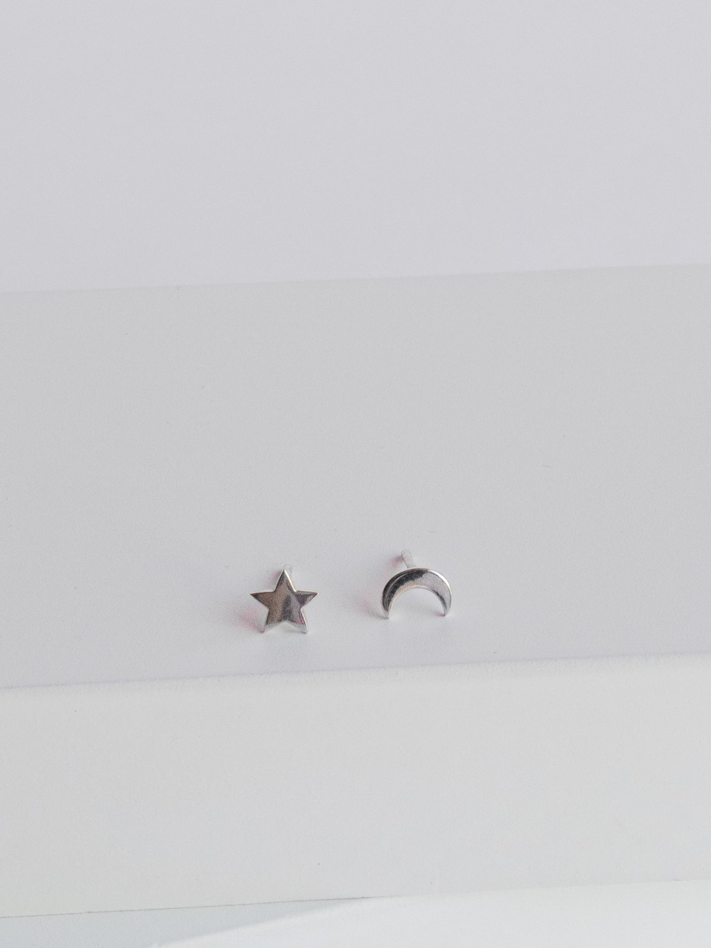 Silver Crescent Moon & Star Stud Earrings are a cute little mismatched crescent moon and star stud earrings set that measure approx. 1/4 inch in size. Made with high quality sterling silver metal.