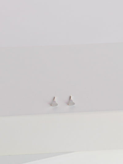 Silver Tiny Heart Stud Earrings are made from lightweight, shiny sterling silver and measure approximately 3.5 mm across.
