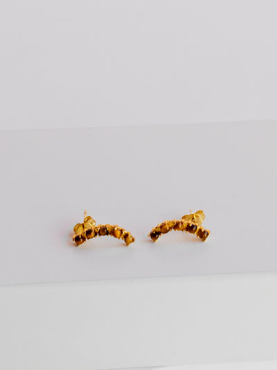 GOLD TIGERS EYE PAVE CRAWLER STUDS. Made of recycled brass with 24K gold overlay. Attached to stainless steel post with 24K gold overlay.