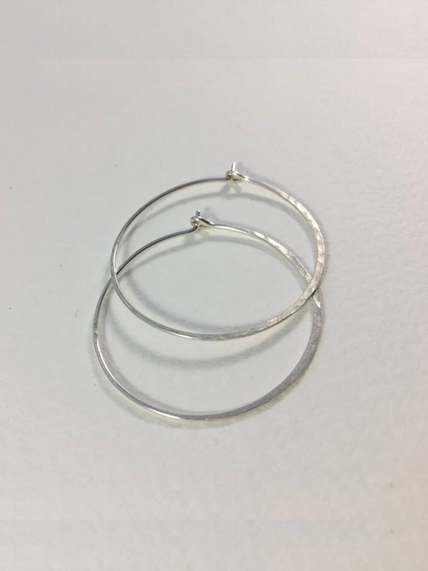 Silver Large Crescent Moon Hoops made from 20 gauge wire are hand made with high quality hammered sterling silver metal and measure 1.5" across.