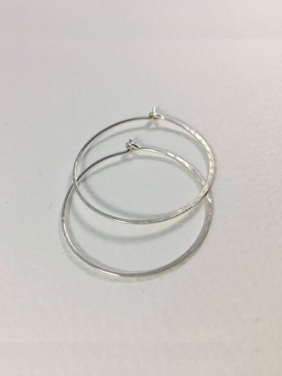 Silver Large Crescent Moon Hoops made from 20 gauge wire are hand made with high quality hammered sterling silver metal and measure 1.5" across.