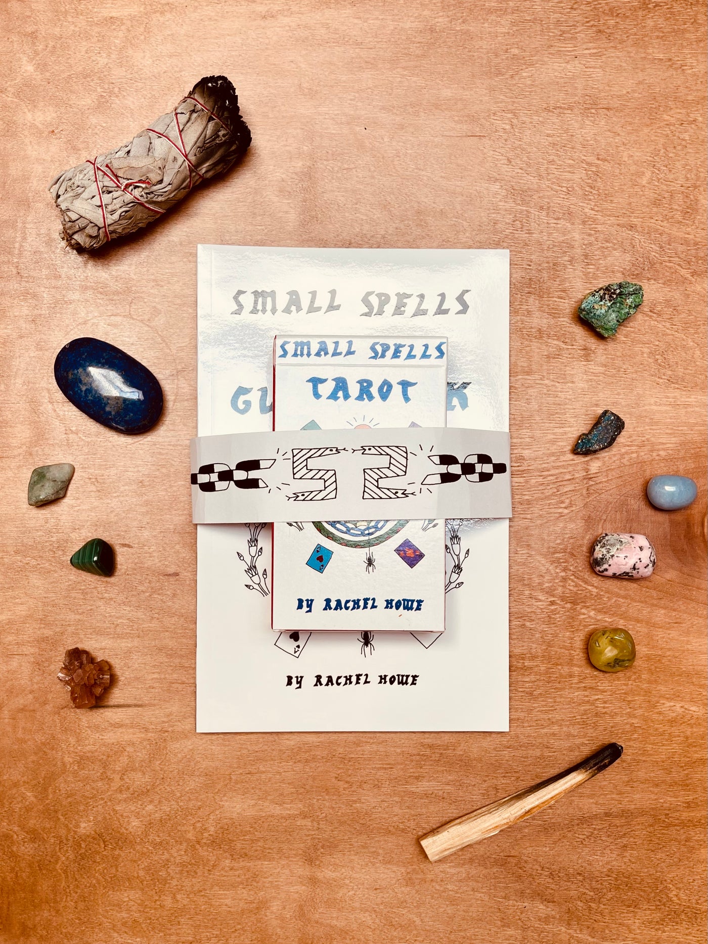 The Small Spells Color Tarot Deck includes all 78 cards of the Major and Minor Arcana and features illustrations that embrace mysticism while staying firmly rooted in the culture of modern design. The accompanying book contains reproductions of the drawings along with writing about the corresponding meanings from creator Rachel Howe’s perspective, which pulls from tradition as well as her own investigations and intuitions.