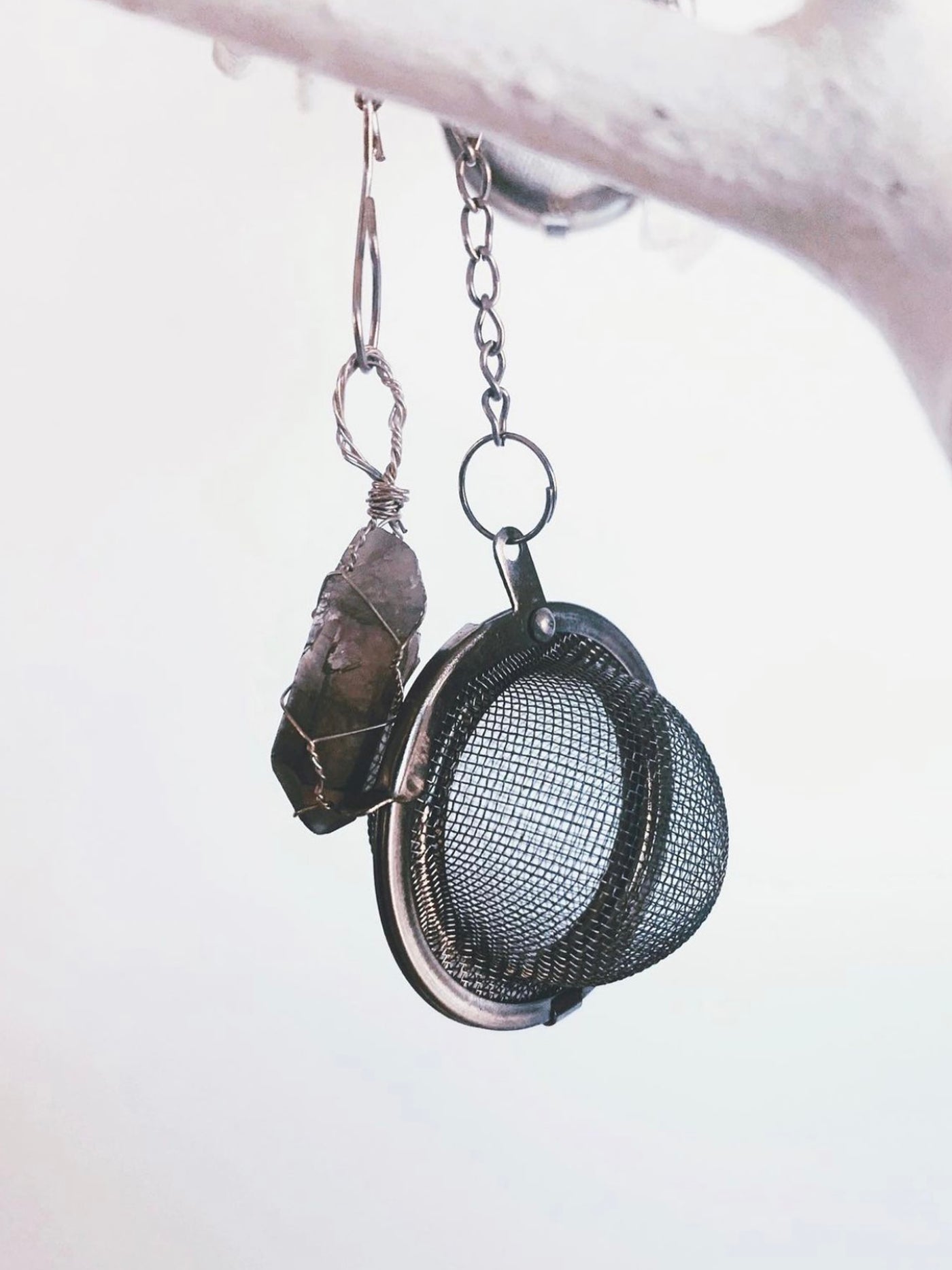 A fun and beautiful way to steep and charge your loose tea blends. Stainless steel tea ball with a hand wrapped crystal in silver wire. Smokey Quartz is for detoxing, grounding and balancing, clears out negativity and instills a sense of calm.