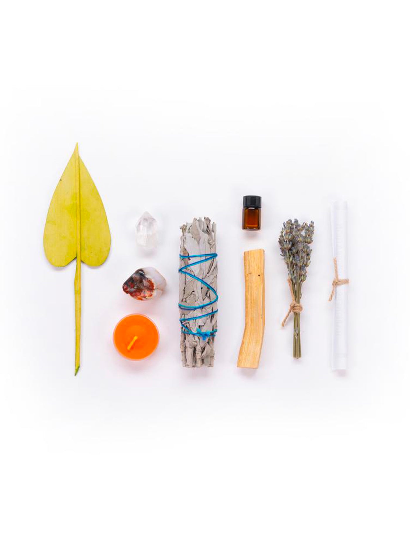 This Ritual Kit includes: Dried lavender mini bouquet, Cedar essential oil, Orange candle, Carnelian, One or two quartz crystals (depending on size/ weight), California white sage stick, Holy palo santo wood from South America and a palm leaf.