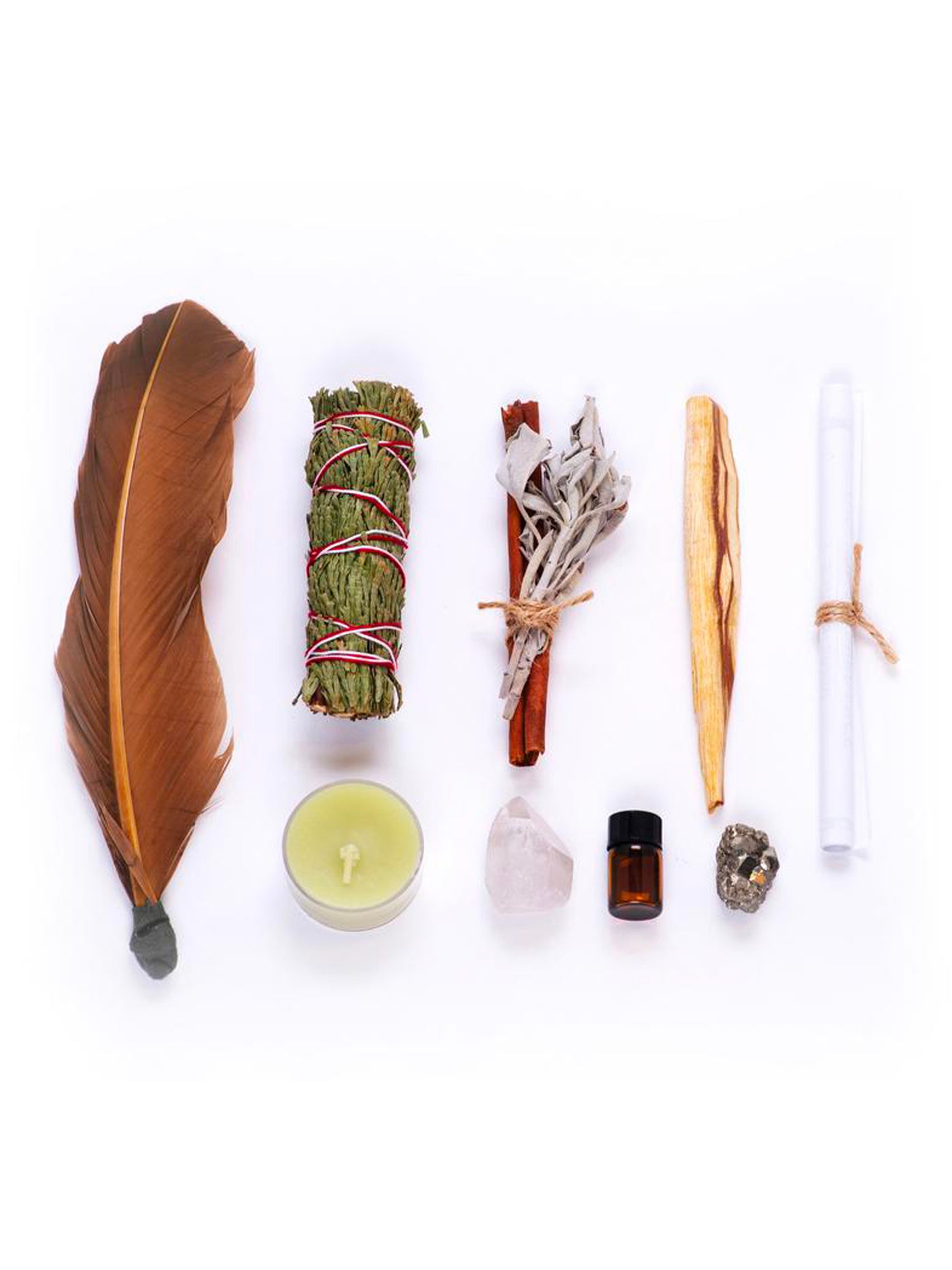 This Ritual Kit includes: California white sage sprig, Cinnamon stick, Cedar leaf stick, Patchouli essential oil, Pyrite ("fools gold") cluster or cube, One or two quartz crystals (depending on size/ weight), Green candle, Holy palo santo wood from South America, and a Turkey feather.
